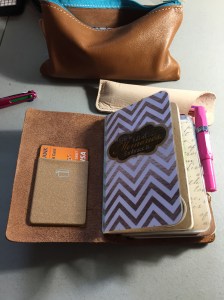 Card pocket attached to inside cover